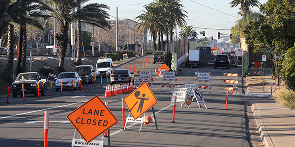 construction sign indicating a closed lane in the road