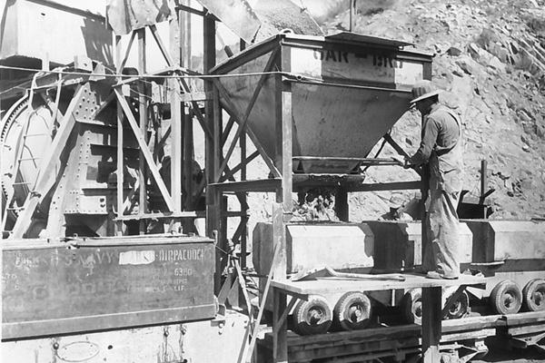 black and white capture of old mining equipment digging waterways in the 40s