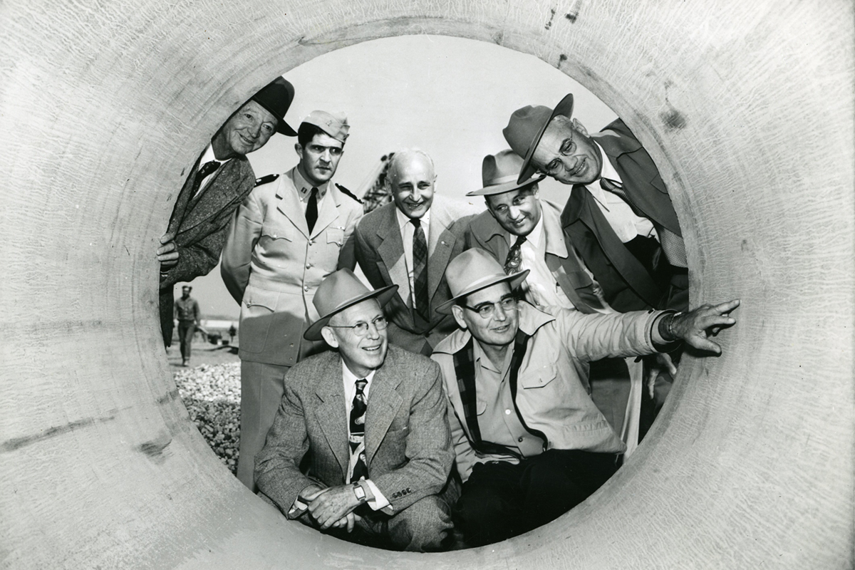 people posing for a picture in the first pipe